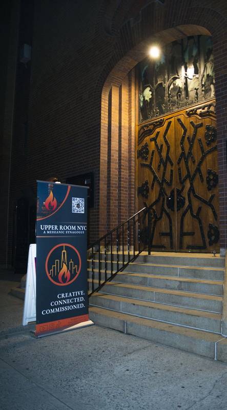 Upper Room NYC entrance at night